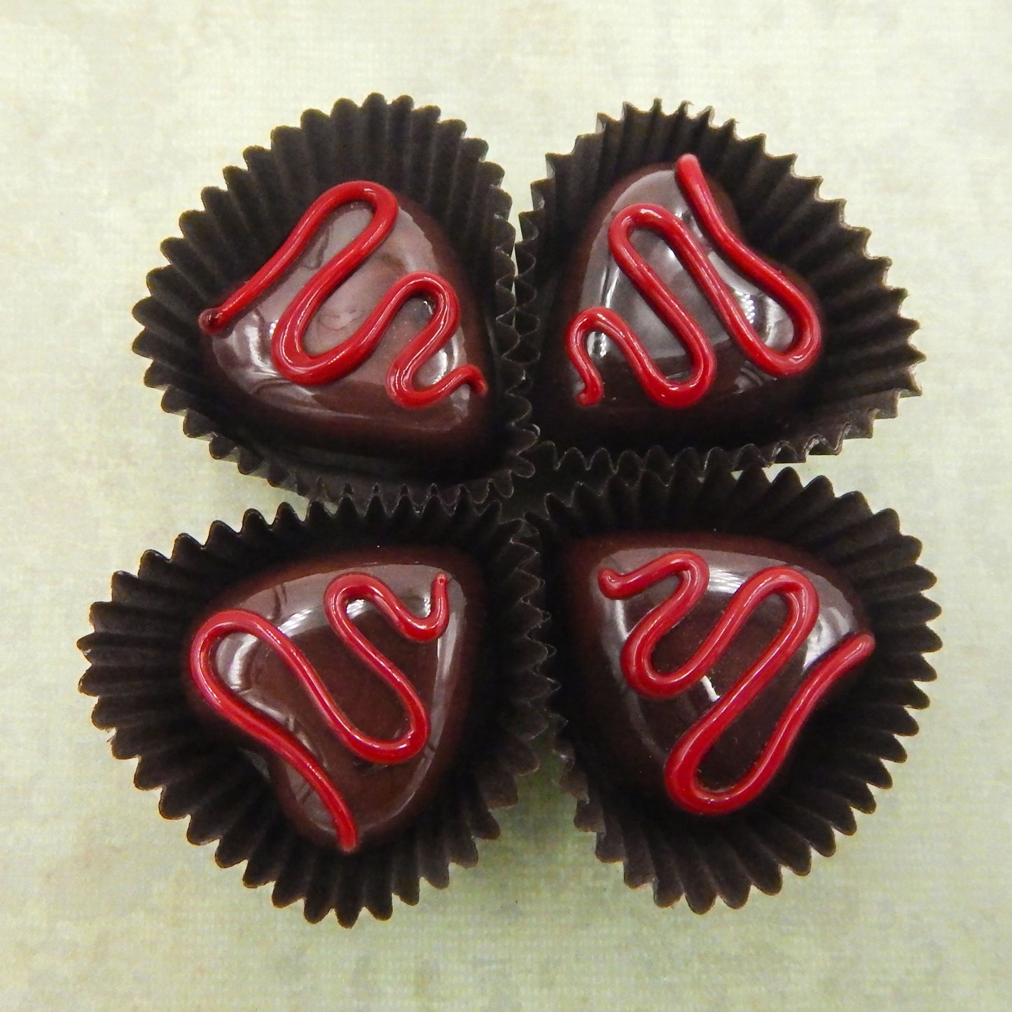 Heart-Shaped Chocolate Treats with Drizzles of Creamy Frosting - Assorted Colors (14-059+)