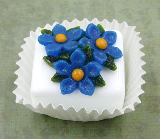 Blue Flax atop a White Petit Four Chocolate (81-114W)