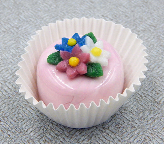 Three Flower Nosegay atop a Pink/White Petit Four Chocolate (81-123S)