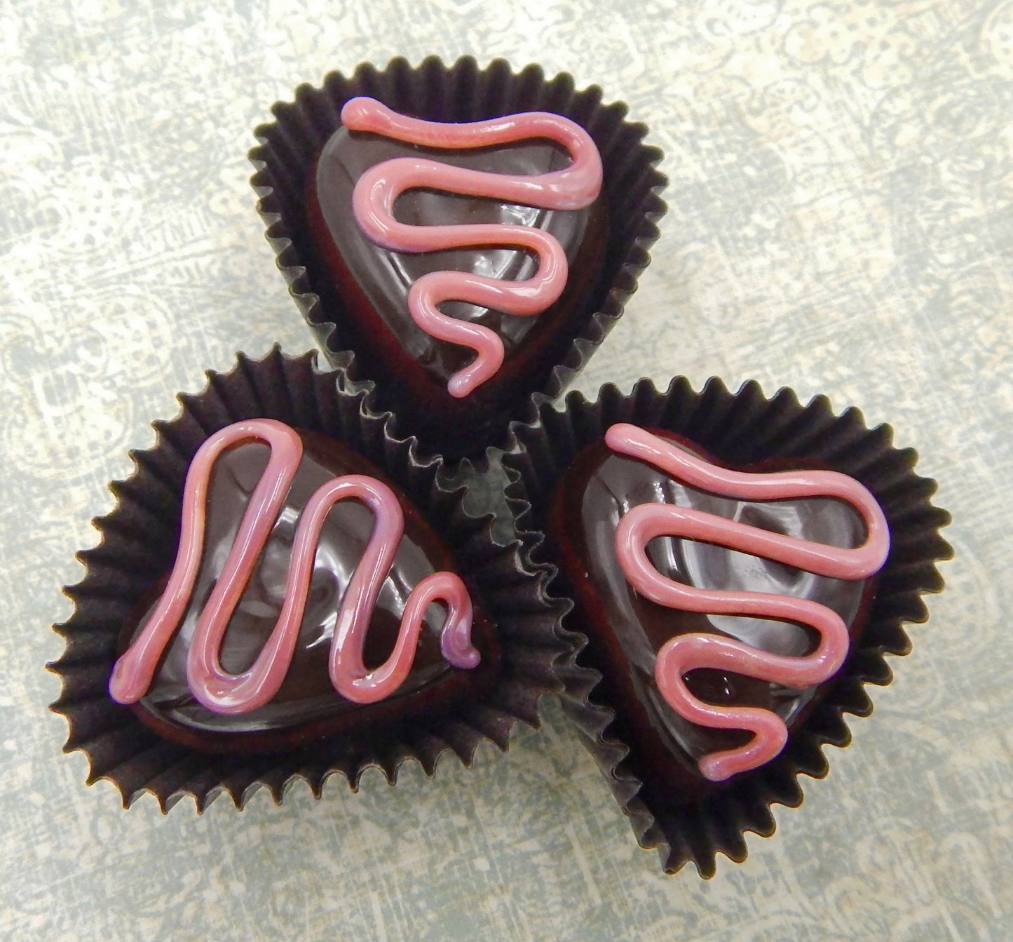 Heart-Shaped Chocolate Treats with Drizzles of Creamy Frosting - Assorted Colors (14-059+)