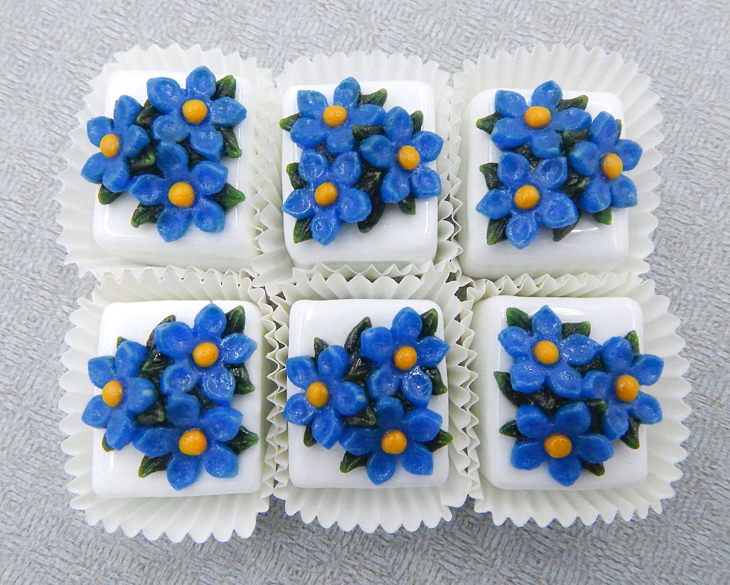 Blue Flax atop a White Petit Four Chocolate (81-114W)