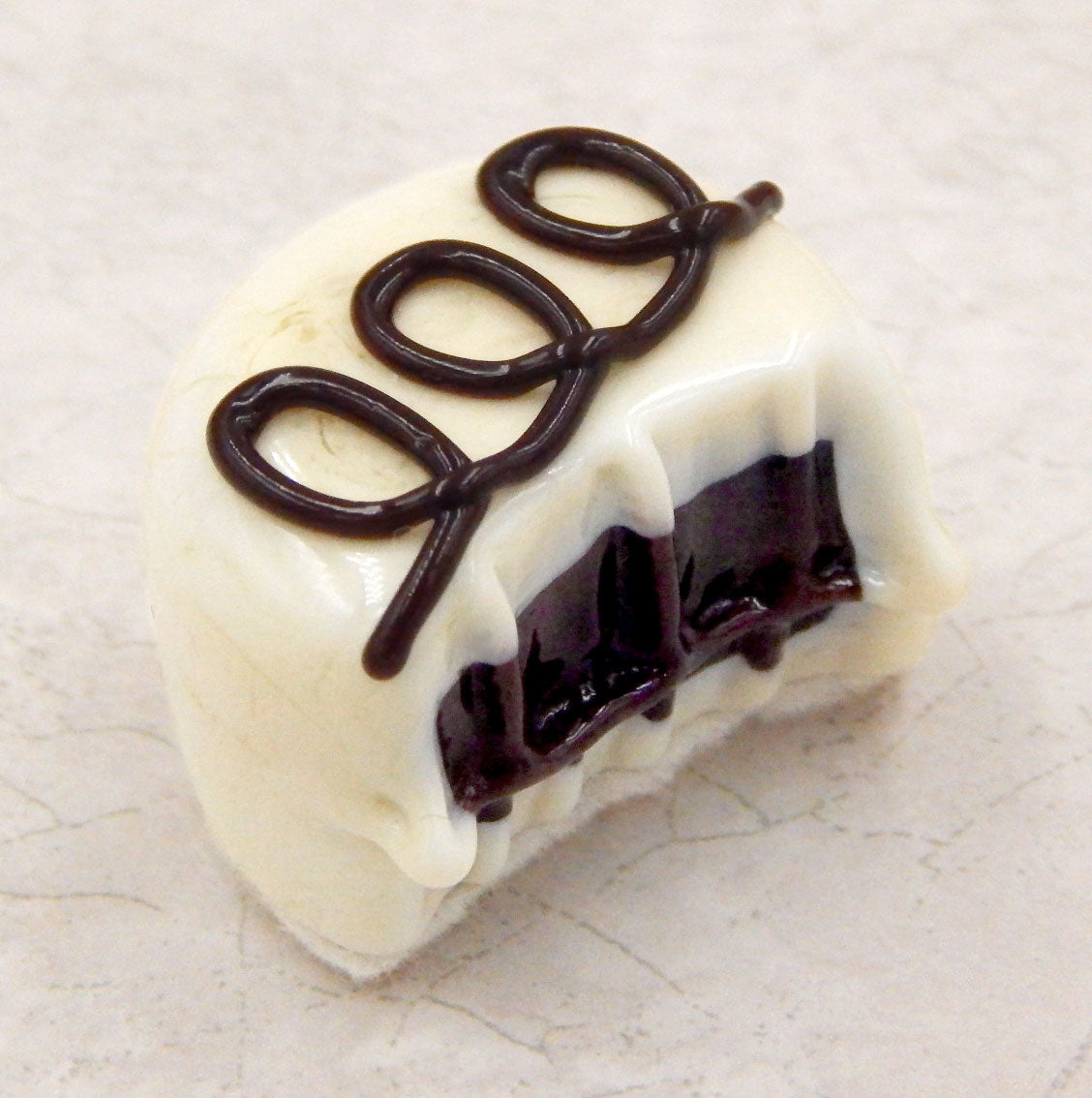 Bitten Vanilla Chocolate with Dark Chocolate Loops (B16-021VCC)